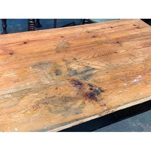 582 - A vintage pine kitchen table, on a black painted base with ring turned legs, 120x74x75cmH