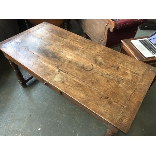 579 - An oak refectory table, incorporating 18th century elements, the top with cleated ends, on turned su... 