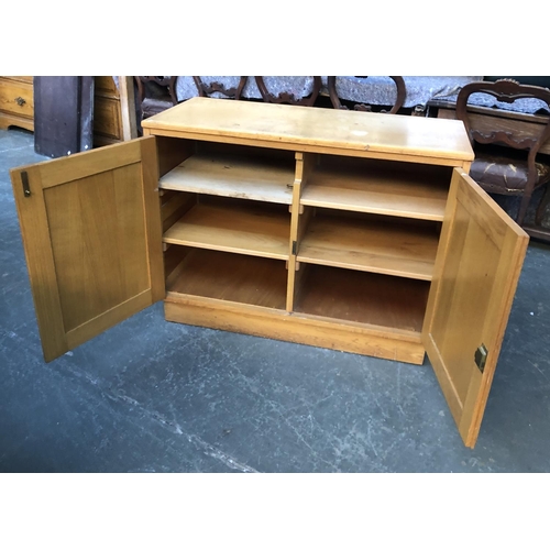 597 - A mid century c.1960 light oak cupboard, 100x45x75cmH