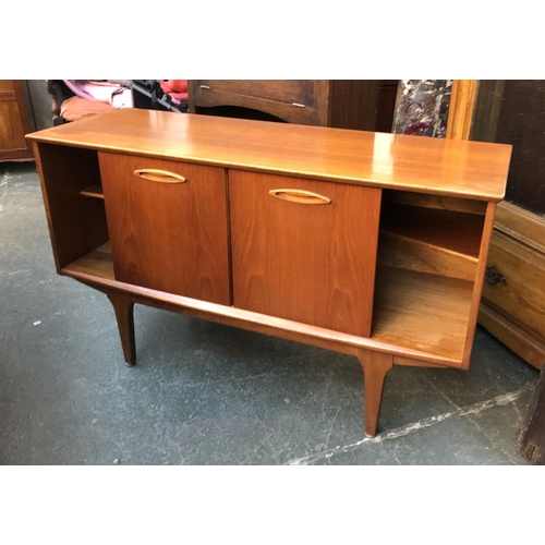 620 - A mid century teak sideboard, three drawers flanked by sliding cupboards, 128x44x74cmH