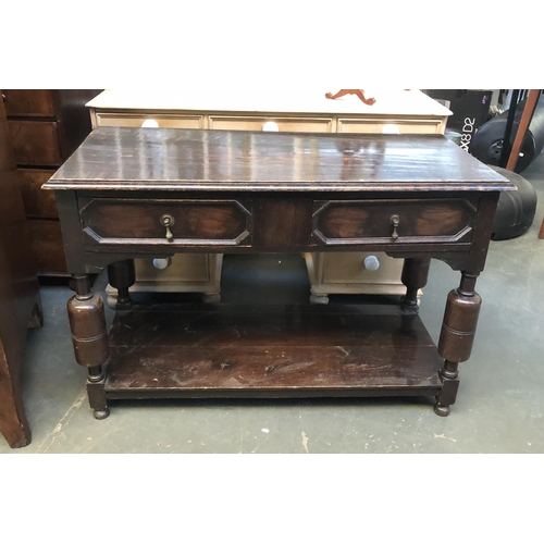 681 - An oak side table in 17th century style, two geometric drawers, on turned supports with undershelf, ... 