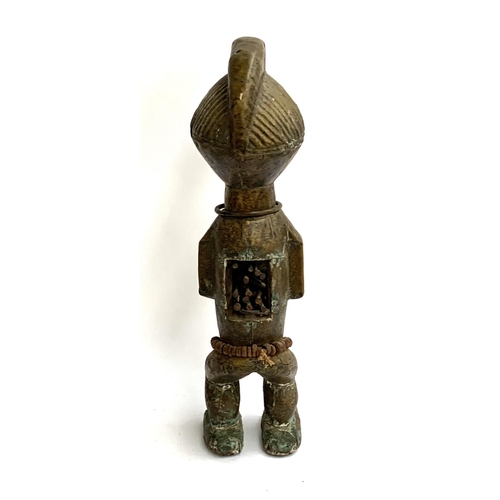 263 - A large colonial period copper clad West African power figure, having cowrie shell eyes, metal teeth... 