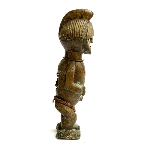 263 - A large colonial period copper clad West African power figure, having cowrie shell eyes, metal teeth... 