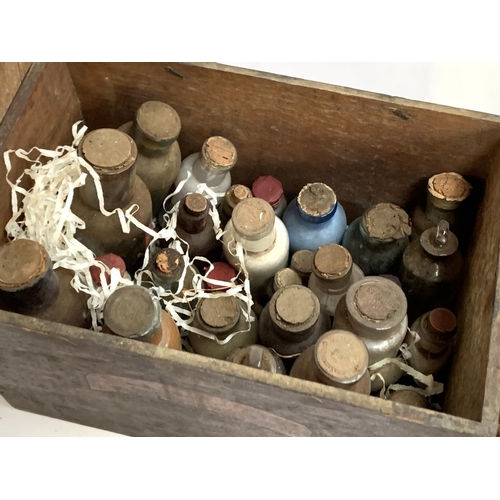 138 - An oak pharmacist's storage box, labelled Anisi Sem.p., together with a large quantity of drug jars