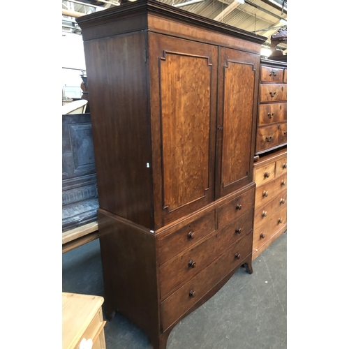 670 - A Regency mahogany linen press, the top converted to a hanging rail, with two cupboard doors, the ba... 