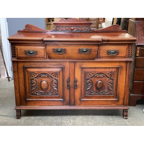 699 - Early 20th century carved mahogany sideboard, three drawers over two carved cupboard doors, 136x51x9... 