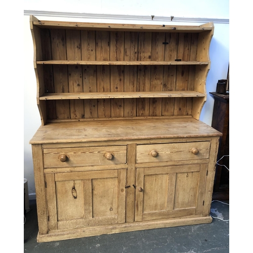 761 - A 19th century pine kitchen dresser, three shelves, with cup hooks, over a base of two drawers and c... 