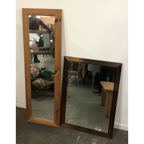 763 - A pine framed long mirror, 134x43cm; together with one other 85x60cm