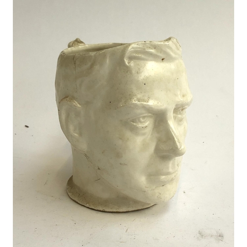 143 - An unusual commemorative mug in the form of the head of King Edward VIII, 12.5cmH