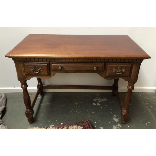 766 - A reproduction side table with three draws, 107x56x79cm