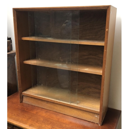 767 - A Gibbs mid century glazed book case with sliding doors and adjustable shelves, 76x24x83cmH