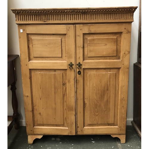 768 - A shallow pine cupboard, with panel doors and three adjustable shelves, one bracket foot detached, 9... 