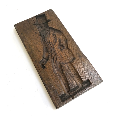 146 - A Dutch board carved with a lady one side and a gentleman the other, 'No XXI' carved to one side, 41... 