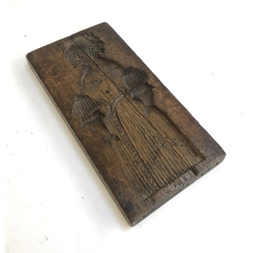 146 - A Dutch board carved with a lady one side and a gentleman the other, 'No XXI' carved to one side, 41... 