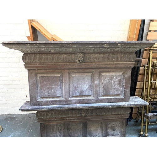 661 - Two oak panelled and carved fire places, each with central lion mask detail, each 153cmW