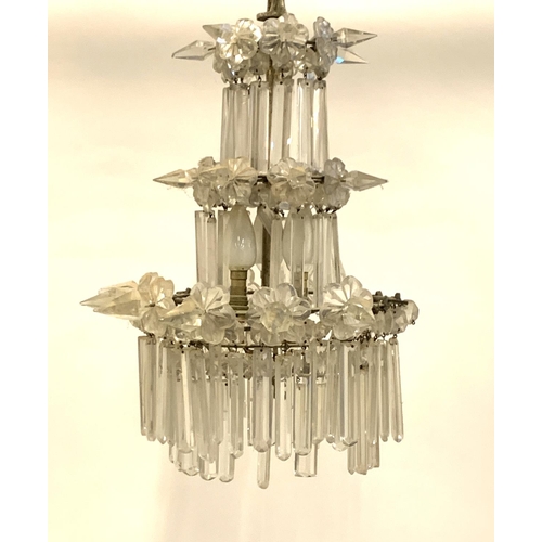 305 - A three tier glass drop chandelier, approx. 50cmH