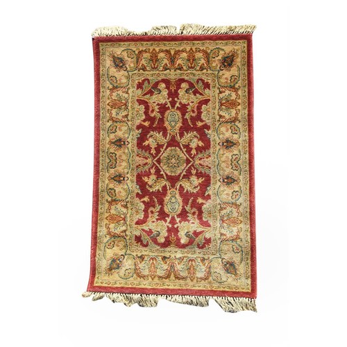 535A - An agra carpet, approximately 242x171cm, together with another smaller, similar rug, approximately 1... 