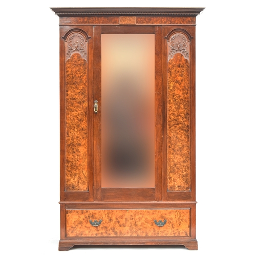 643 - A burr walnut and carved hanging wardrobe, 20th century, with central mirrored door over single draw... 