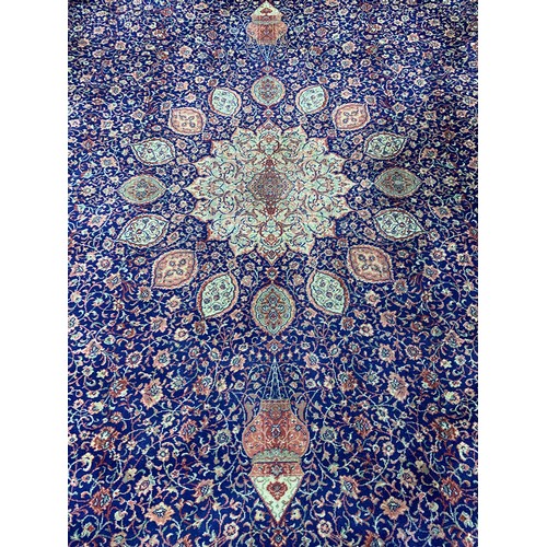 535 - A very large blue ground wool rug, with central medallion and hanging lantern pattern, 410x320cm