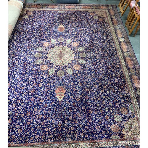 535 - A very large blue ground wool rug, with central medallion and hanging lantern pattern, 410x320cm