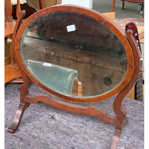 780 - A 19th century oval adjustable dressing mirror with bevelled glass, 50cmW