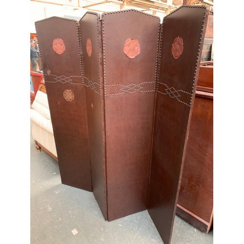 666A - A studded leather effect folding screen with applied Tudor rose decoration, 169cmH