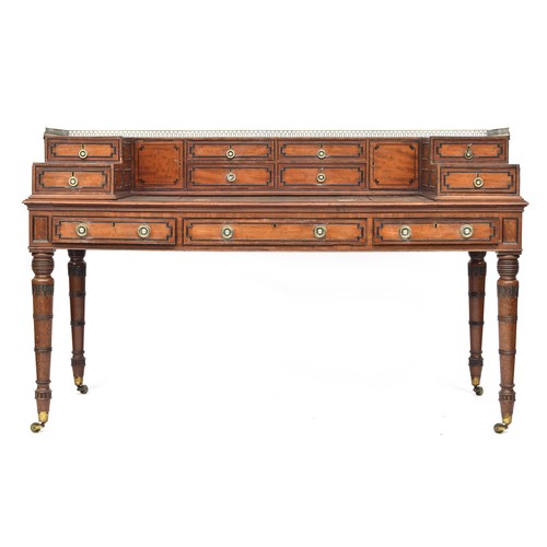 574 - An early 19th century Carlton House style desk, brass gallery, over a superstructure with four centr...