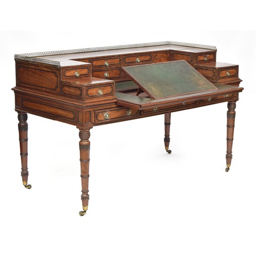 574 - An early 19th century Carlton House style desk, brass gallery, over a superstructure with four centr... 