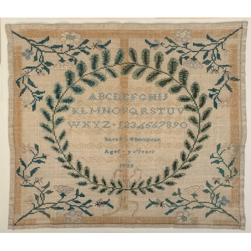 229 - A Georgian needlework alphabet sampler, with wreath and floral decoration, worked by Sarah Thompson,... 