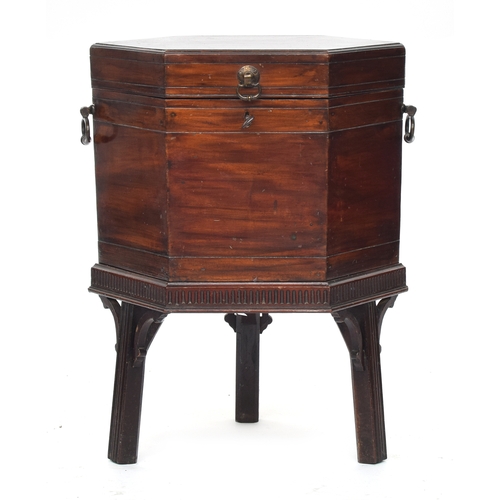 548 - A 19th century mahogany hexagonal cellarette, with divided interior, twin brass handles, and square ... 