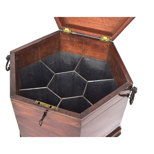 548 - A 19th century mahogany hexagonal cellarette, with divided interior, twin brass handles, and square ... 