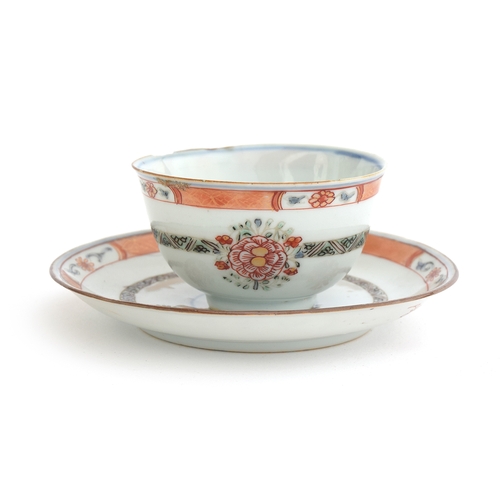 157 - A Chinese teacup and saucer, floral decoration with orange rim, heightened in gilt, the cup 7.5cm di... 