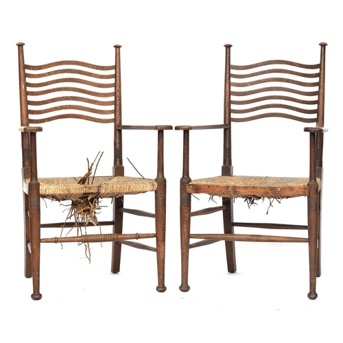 624 - A pair of Arts & Crafts ladderback open armchairs in the manner of William Birch, with rush seats, 6... 