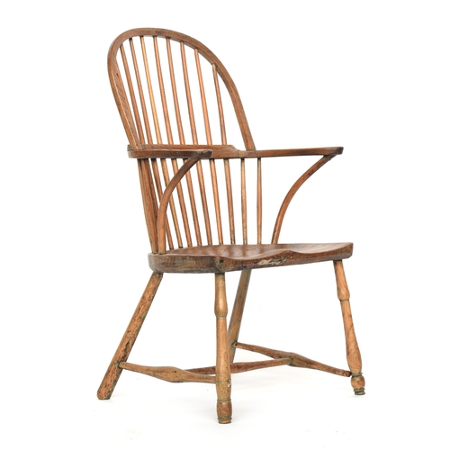 625 - A provincial elm West Country stick back Windsor chair, three part arm bow on bent supports, over a ... 