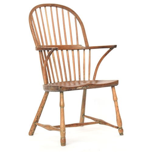 625 - A provincial elm West Country stick back Windsor chair, three part arm bow on bent supports, over a ... 