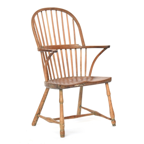 625 - A provincial elm West Country stick back Windsor chair, three part arm bow on bent supports, over a ... 