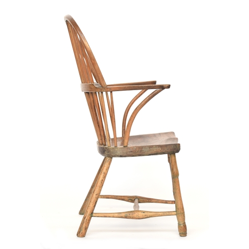 625 - A provincial elm West Country stick back Windsor chair, three part arm bow on bent supports, over a ... 