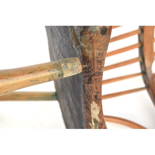 625 - A provincial elm West Country stick back Windsor chair, three part arm bow on bent supports, over a ... 