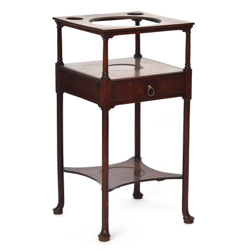 645 - A George II mahogany washstand, the top with cutout for washbowl, drawer below and undershelf, on pa... 