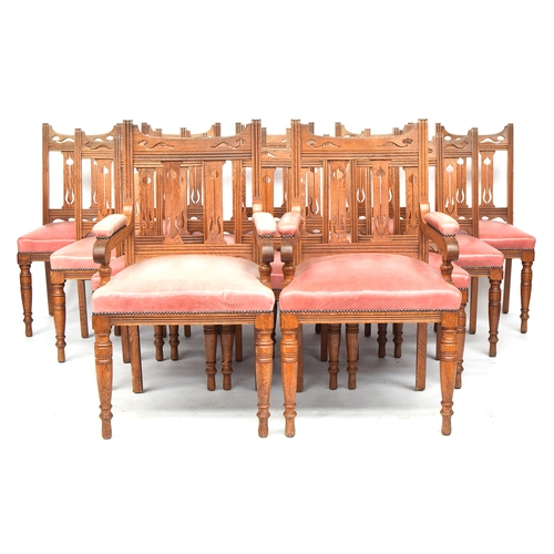 594 - A good set of 14 early 20th century Arts & Crafts oak dining chairs, Liberty style, two carvers, eac... 