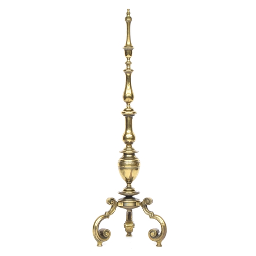 380 - A heavy brass standard lamp, the turned column on three scrolling legs, 135cm high