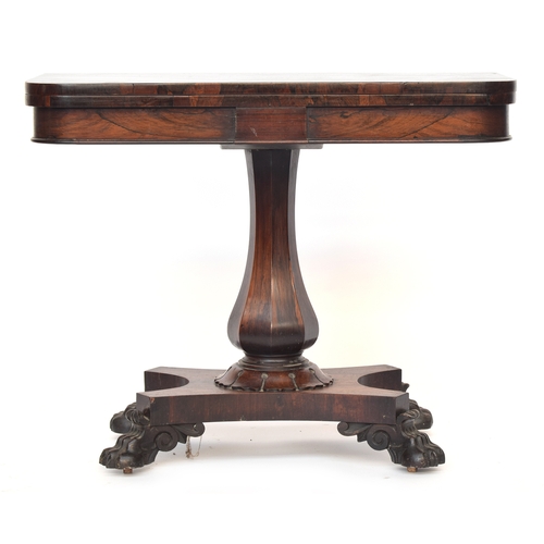 534 - A William IV rosewood card table, on octagonal faceted column, quatrefoil base, with claw feet and c... 