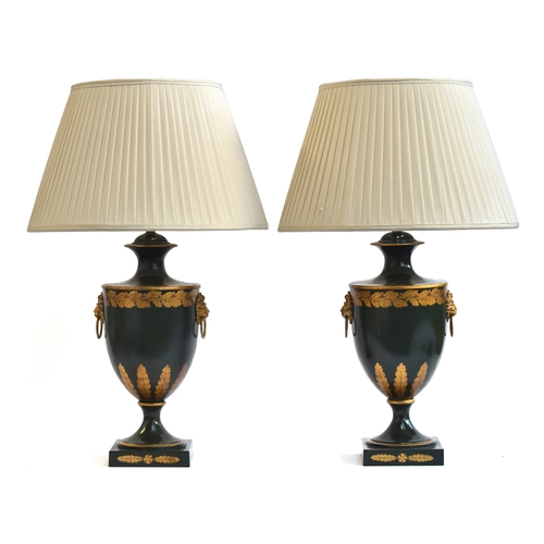 383 - A pair of decorative toleware table lamps, in the form of urns, with gilt oak leaf and acanthus deco... 