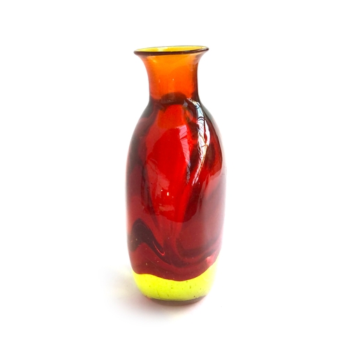 75 - An extremely heavy amber coloured art glass vase, of compressed form, 26.5cm high