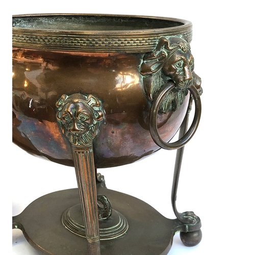 189 - A copper samovar (af), with twin lion mask handles; together with three Victorian copper and iron sa... 