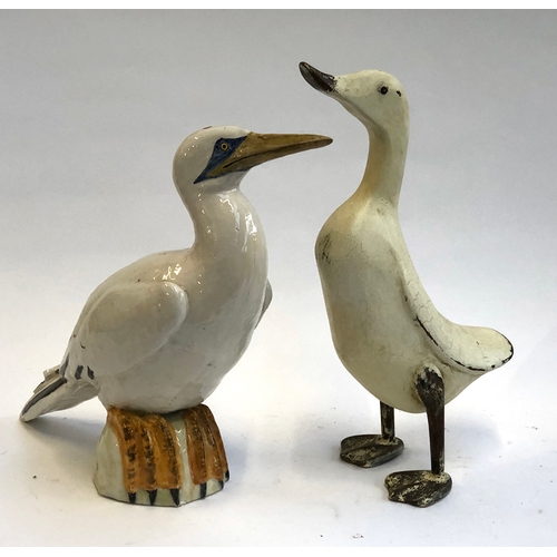 82 - An Italian studio pottery bird (af), 35cmH; together with a carved wooden duck (2)