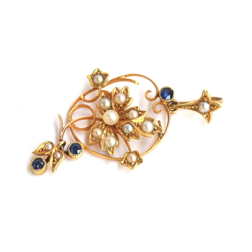 22 - An Edwardian 15ct gold pendant of foliate form, set with seed pearls and sapphires, 4cm long, approx... 