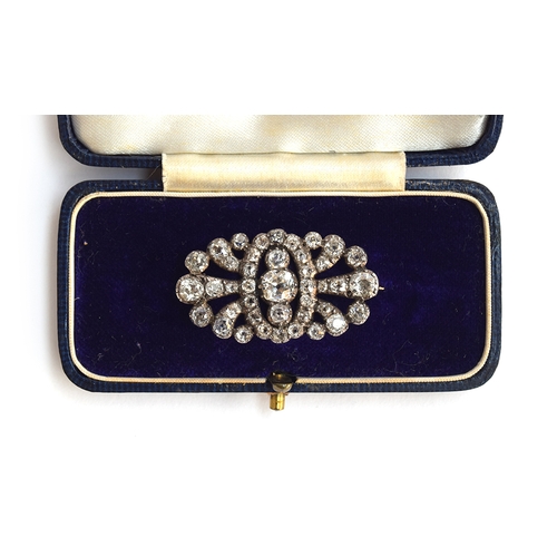 12 - A Victorian diamond brooch of openwork form, set with 41 old cut diamonds in pinched collet settings... 