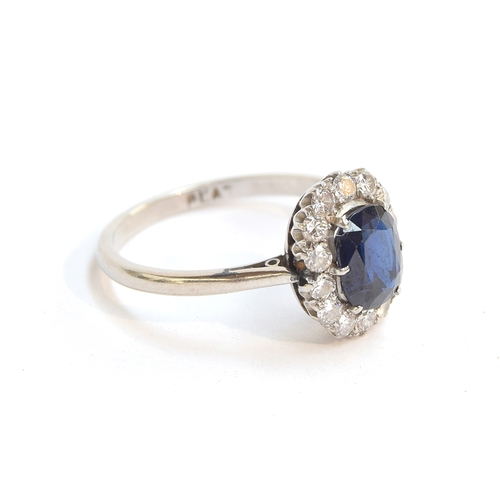 1 - An early 20th century platinum, sapphire and diamond cluster ring, the sapphire approx. 1.2ct, size ... 