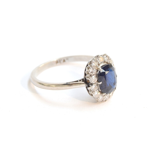 1 - An early 20th century platinum, sapphire and diamond cluster ring, the sapphire approx. 1.2ct, size ... 